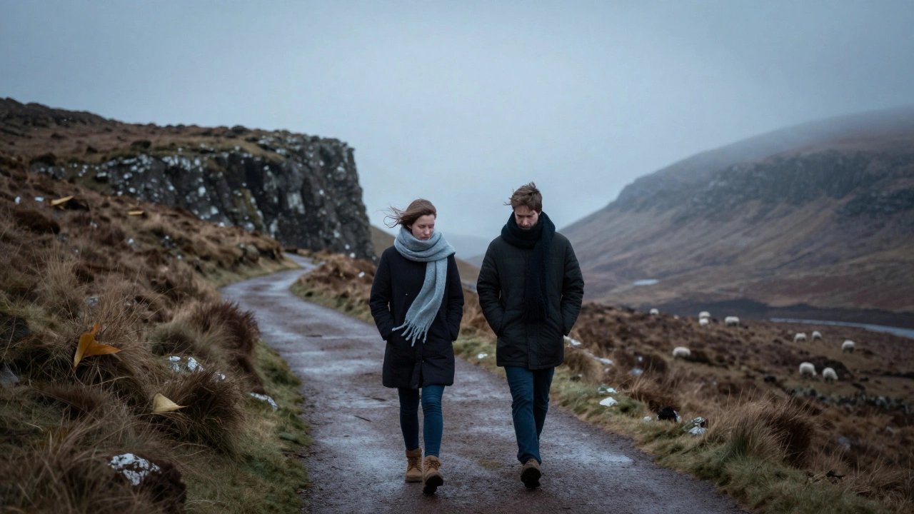A couple walks along a misty Scottish cliff, wrapped in scarves, no devices in sight.