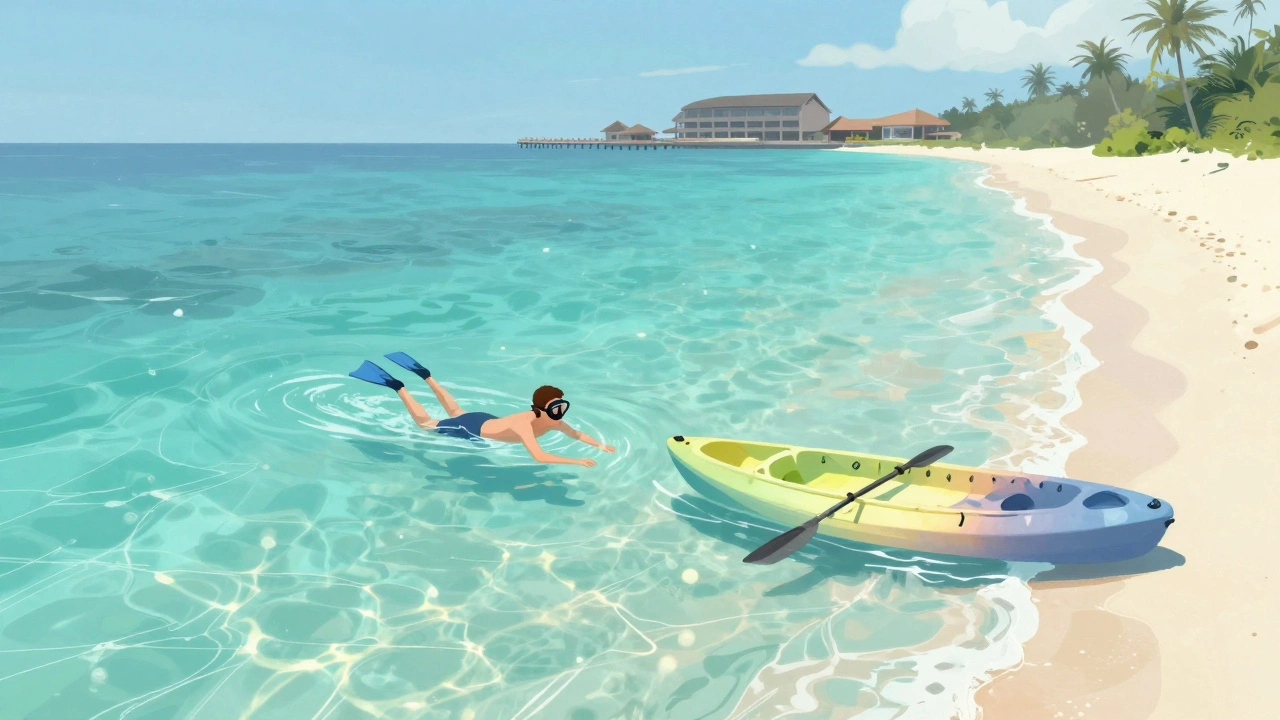 Snorkeler relaxing on secluded local island beach with kayak.