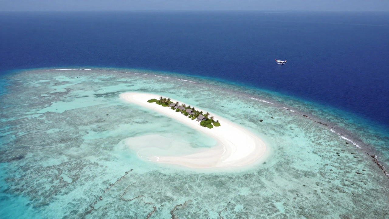 Aerial view of secluded Maldives resort island with clear turquoise waters
