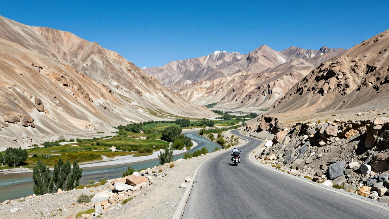 Winding road through rugged Ladakh mountains under bright summer sun