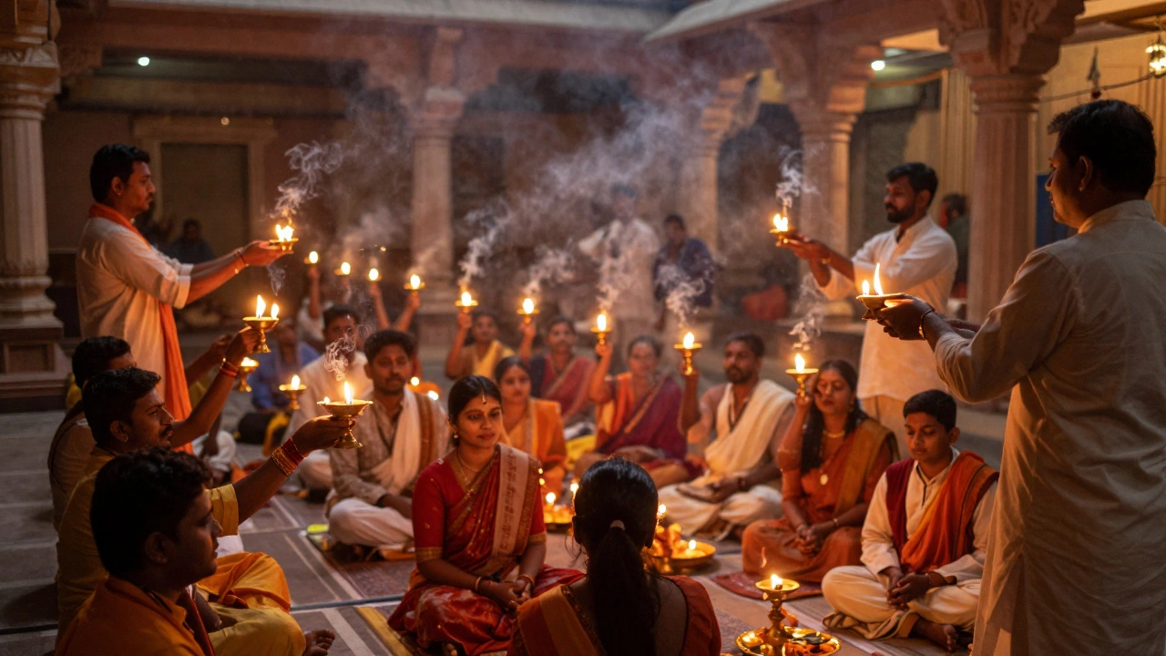 Devotees watching evening lamp ceremony in an ornate temple courtyard
